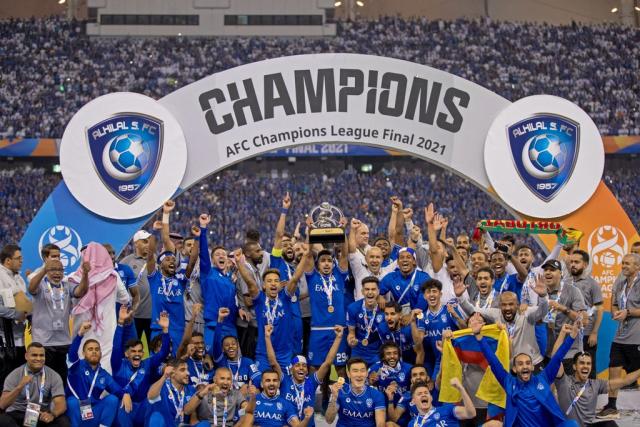 Saudi Arabia's Al Hilal soccer team players celebrate their trophy