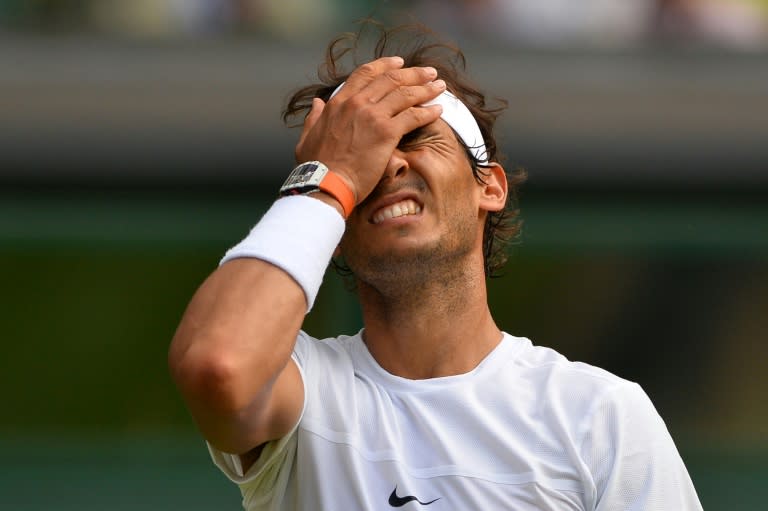 Spain's Rafael Nadal reacts after a point against Germany's Dustin Brown during their men's singles second round match on day four of the 2015 Wimbledon Championships at The All England Tennis Club in Wimbledon, southwest London, on July 2, 2015