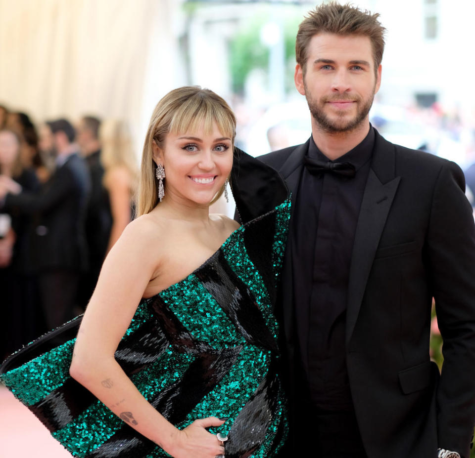 Close-up of Miley and Liam smiling together