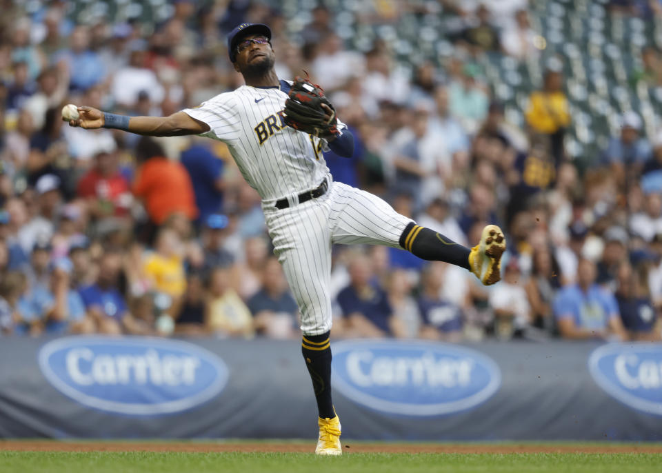 Milwaukee Brewers' Andruw Monasterio throws out Pittsburg Pirates' Andrew McCutchen during the third inning of a baseball game Saturday, Aug 5, 2023, in Milwaukee. (AP Photo/Jeffrey Phelps)