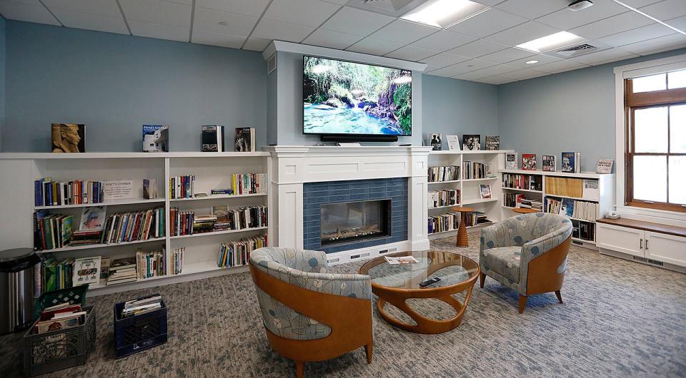 A large smart TV is central in the spacious library room of the new wing of the Marshfield Senior Center at 230 Webster St.