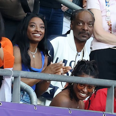 <p>Pascal Le Segretain/Getty</p> Simone Biles and Snoop Dogg