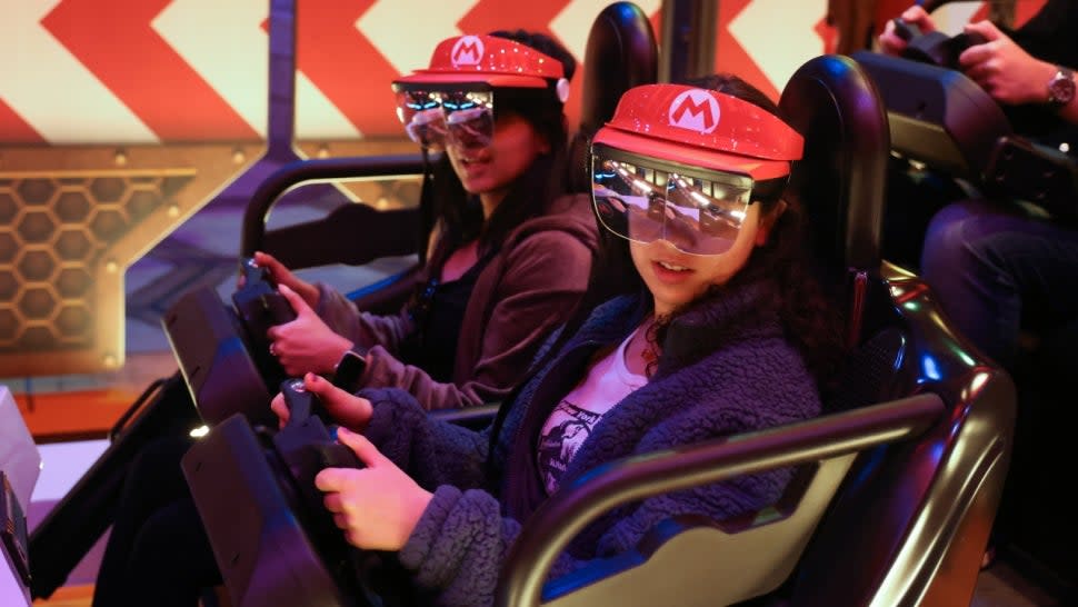 Guests ride Mario Kart: Bowser's Challenge at Super Nintendo World in Universal Studios Hollywood.