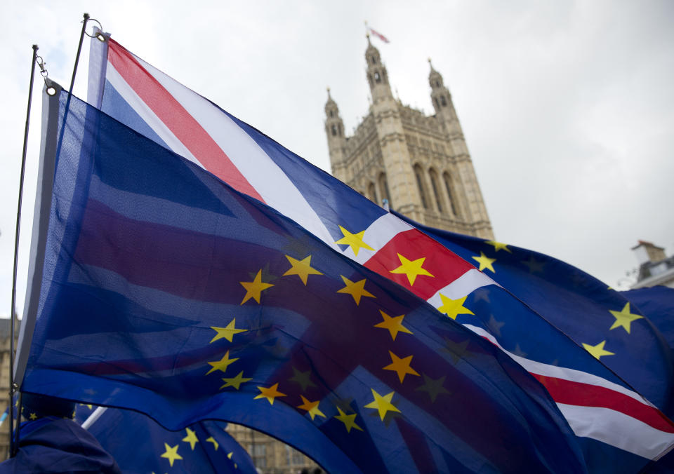 Union Jack and EU flags. The IMF downgraded UK growth expectations