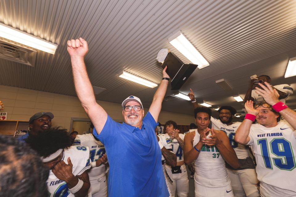 Head Coach Pete Shinnick celebrates in the locker room after back-to-back GSC titles. November 5, 2022