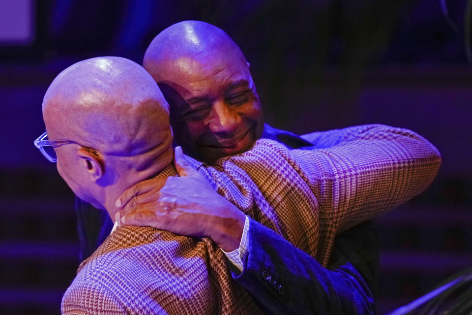 Branford Marsalis, facing, is greeted by Ford Foundation president Darren Walker as he is introduced as the new artistic director for the Ellis Marsalis Center at The Musician's Village in New Orleans, Tuesday, Jan. 30, 2024. (AP Photo/Gerald Herbert)