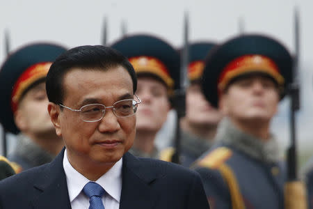 China's Prime Minister Li Keqiang arrives at Moscow's Vnukovo airport, October 12, 2014. REUTERS/Maxim Zmeyev/Files