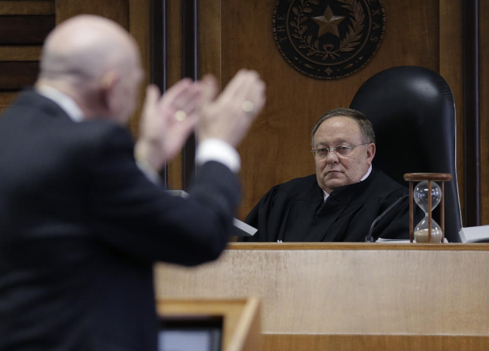 State District Judge John Dietz, right, listens to plaintiff attorney Leonard Schwartz's, foreground, closing arguments in the second phase of Texas' school finance trial before , Friday, Feb. 7, 2014, in Austin, Texas. (AP Photo/Eric Gay)