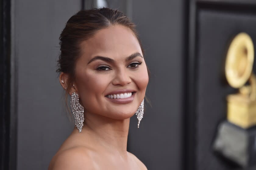 Chrissy Teigen arrives at the 64th Annual Grammy Awards at the MGM Grand Garden Arena on Sunday, April 3, 2022, in Las Vegas. (Photo by Jordan Strauss/Invision/AP)