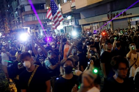 Anti-extradition bill protesters point laser beams, at Sham Shui Po, in Hong Kong