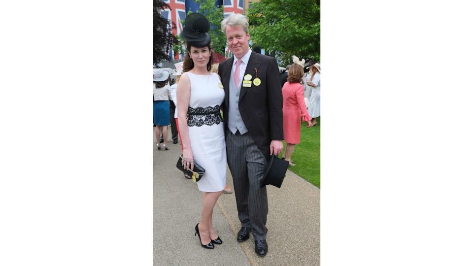 Charles Spencer in a suit with wife Karen in a white dress