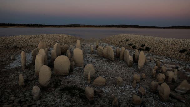 PHOTO: The dolmen of Guadalperal, also known as the Spanish Stonehenge, is revealed due to the receding waters of the Valdecanas reservoir in the outskirts of El Gordo, Spain, Aug, 3, 2022. (Susana Vera/Reuters)