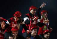 Members of the Canada team celebrate during the closing ceremony for the Sochi 2014 Winter Olympics, February 23, 2014. REUTERS/Lucy Nicholson (RUSSIA - Tags: SPORT OLYMPICS)
