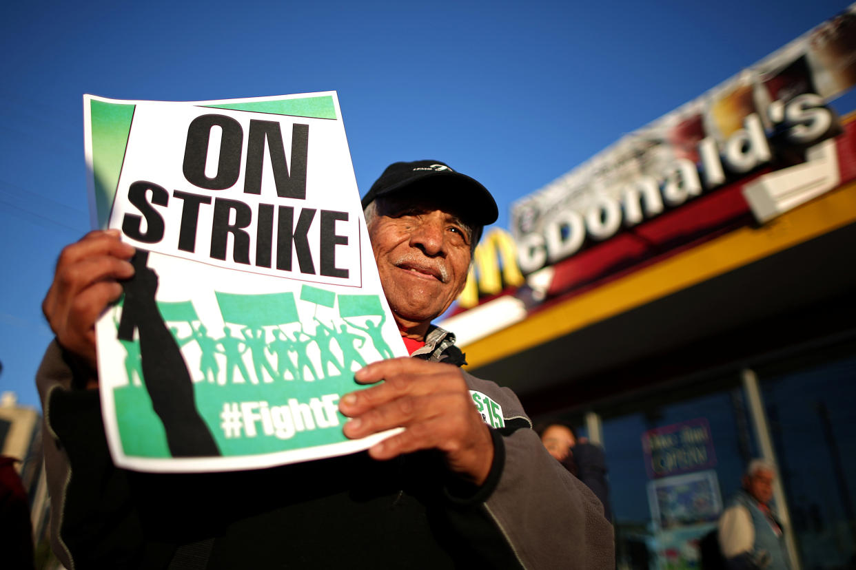 Fast-food workers with the Fight for $15 campaign have rallied in cities around the country for higher minimum wages. (Photo: Lucy Nicholson / Reuters)