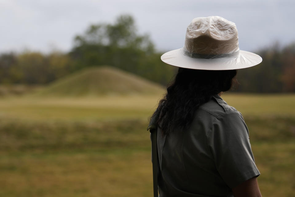 Park Ranger Myra Vick pauses as she guides a tour of the Mound City Group at Hopewell Culture National Historical Park in Chillicothe, Ohio, Saturday, Oct. 14, 2023, before the Hopewell Ceremonial Earthworks UNESCO World Heritage Inscription Commemoration ceremony. A network of ancient American Indian ceremonial and burial mounds in Ohio noted for their good condition, distinct style and cultural significance, including Hopewell, was added to the list of UNESCO World Heritage sites. (AP Photo/Carolyn Kaster)