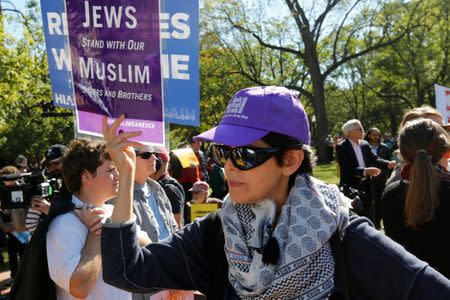 Protesters gather outside the White House for "NoMuslimBanEver" rally against what they say is discriminatory policies that unlawfully target American Muslim and immigrant communities, in Washington, U.S., October 18, 2017. REUTERS/Yuri Gripas