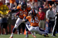 Denver Broncos linebacker A.J. Johnson (45) celebrates his sack against the New York Jets with linebacker Malik Reed (59) during the first half of an NFL football game, Sunday, Sept. 26, 2021, in Denver. (AP Photo/David Zalubowski)