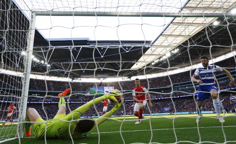 Arsenal goalkeeper Wojciech Szczesny (L) fails to stop a shot by Reading's Garath McCleary to make it 1-1 during their FA Cup semi-final at Wembley stadium on April 18, 2015