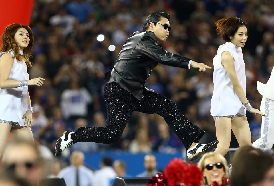 TORONTO, ON - DECEMBER 16: Korean rapper Psy performs at halftime during the Seattle Seahawks NFL game against the Buffalo Bills at Rogers Centre on December 16, 2012 in Toronto, Ontario, Canada. (Photo by Tom Szczerbowski/Getty Images)