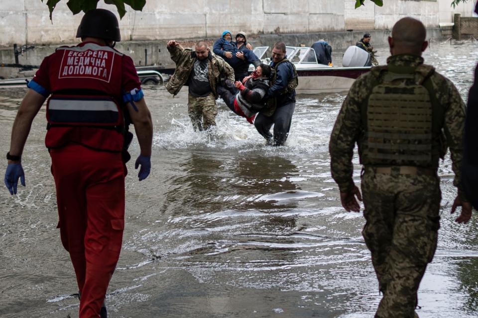 Emergency teams respond to injured civilian evacuees who had came under fire from Russian forces while trying to flee by boat in Ukraine on Sunday, June 11, 2023.
(Credit: AP)