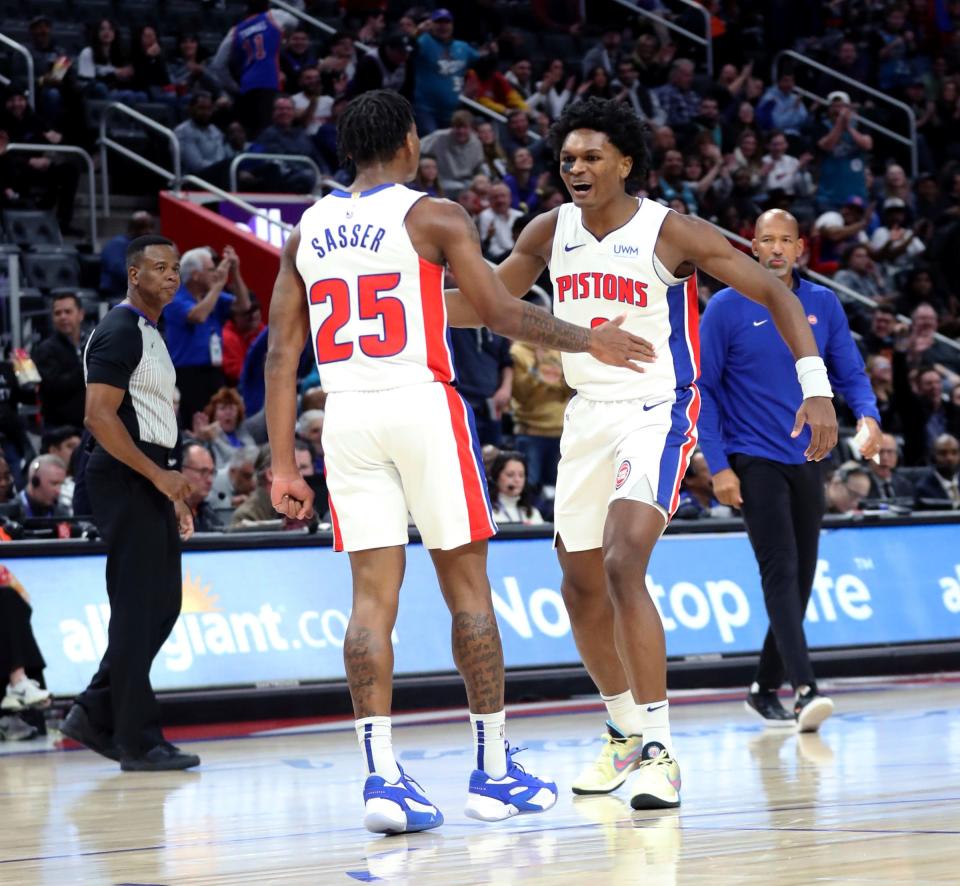 Detroit Pistons guard Marcus Sasser (25) and forward Ausar Thompson (9) celebrate after a score against the Portland Trail Blazers during second-quarter action at Little Caesars Arena in Detroit on Wednesday, Nov. 1, 2023.