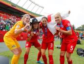 England goalkeeper Carly Telford (21) and forward Toni Duggan (18) and defender Claire Rafferty (3) and defender Steph Houghton (5) display their medals after defeating Germany in the third place match of the FIFA 2015 Women's World Cup at Commonwealth Stadium. England defeated Germany 1-0 in extra time. Mandatory Credit: Erich Schlegel-USA TODAY Sports