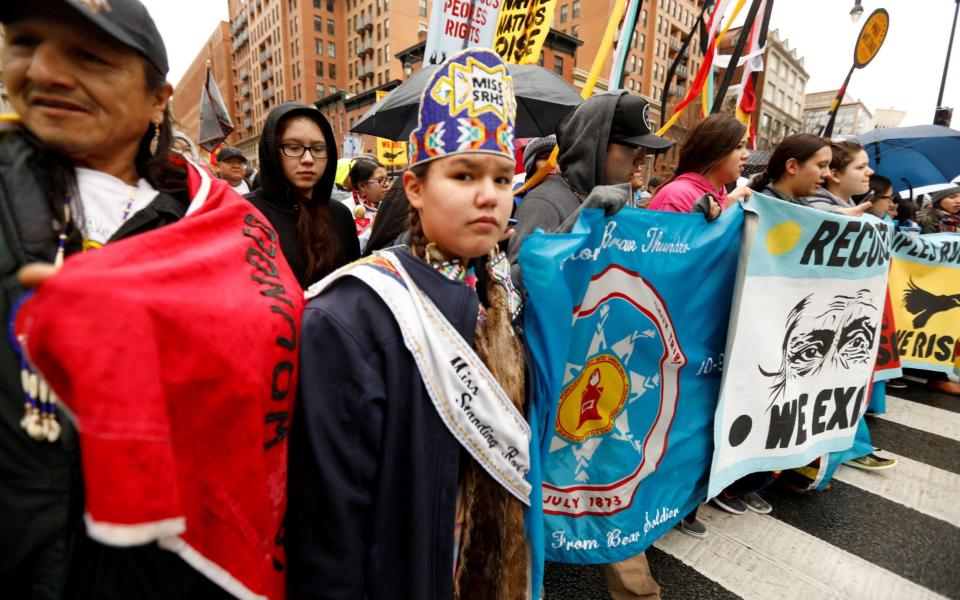 Members of the Standing Rock Sioux Nation and Indigenous leaders at a protest march in 2017 - Reuters