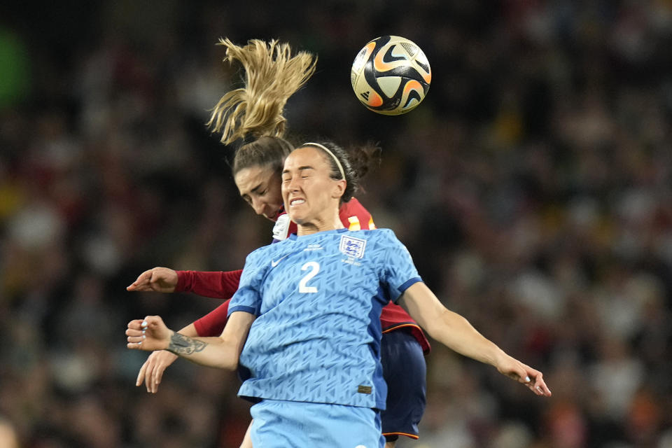 England's Lucy Bronze, right, challenges for the ball with Spain's Olga Carmona during the Women's World Cup soccer final between Spain and England at Stadium Australia in Sydney, Australia, Sunday, Aug. 20, 2023. (AP Photo/Alessandra Tarantino)