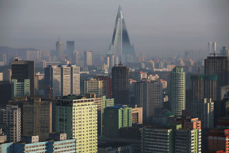 The 105-storey Ryugyong Hotel, the highest building under construction in North Korea, is seen behind residential building in Pyongyang, May 5, 2016. REUTERS/Damir Sagolj