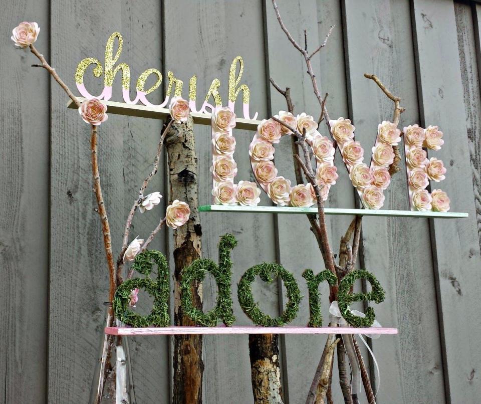 cut out words decorated with nature florals glitter and paint