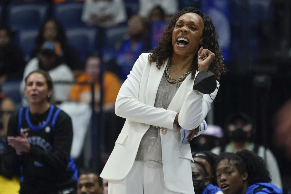 Kentucky head coach Kyra Elzy watches the action in the first half of the NCAA women's college basketball Southeastern Conference tournament championship game against South Carolina Sunday, March 6, 2022, in Nashville, Tenn. (AP Photo/Mark Humphrey)