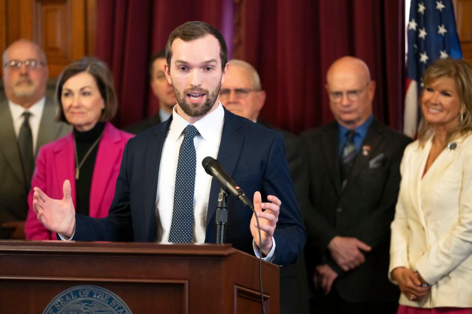 Rep. Skyler Wheeler speaks before Gov. Kim Reynolds signs House File 2612, Wednesday, March 27, 2024, at her office in the Iowa State Capitol.