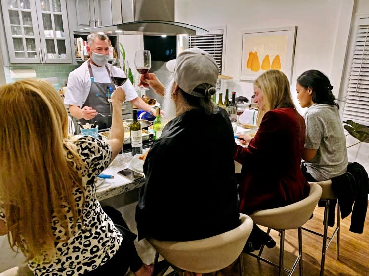 Kevin Meehan, chef-owner of Kali restaurant on Melrose Avenue, cooked a multi-course meal for a small gathering at a customer's home in December. He said the private in-home events have supplemented his takeout revenue and helped keep his business afloat during the shutdown. (Kevin Meehan)