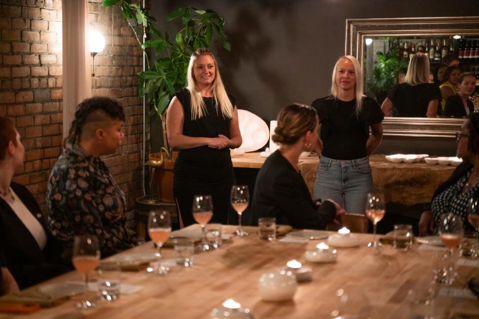 Ceramics artists Claire Thibodeau, 30, of Ferndale, left, and Elizabeth Salonen, 42, of Tecumseh, Ontario, talk with guests during Tablescape, a dinner that merges art and food, at Marrow in Detroit on Friday, Sept. 8, 2023.