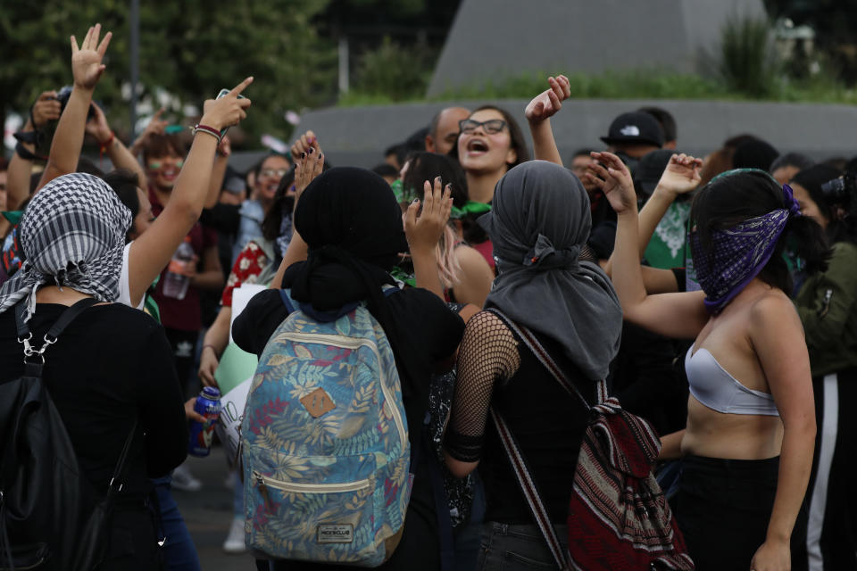 Women join in a protest demanding justice and for their safety, sparked by two recent alleged rapes by police, in Mexico City, Friday, Aug. 16, 2019. (AP Photo/Marco Ugarte)