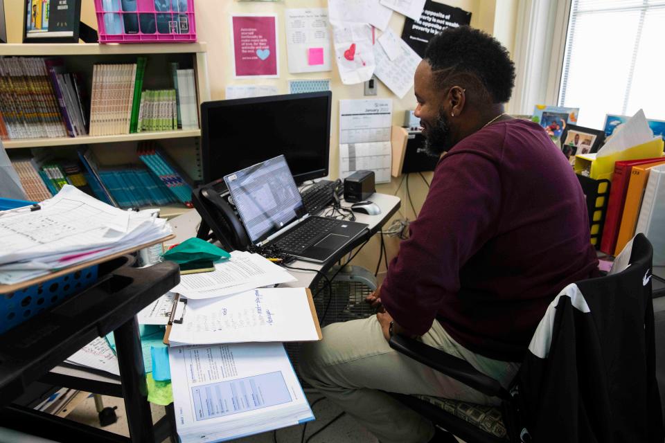 With Cincinnati Public Schools on remote learning, Jaumall Davis, a kindergarten teacher at Oyler School in Lower Price Hill, conducts a math class on Jan. 19, 2022. Many teachers work from home, but Davis chooses to work out of his classroom. Out of 22 students, there were eight on the afternoon call.