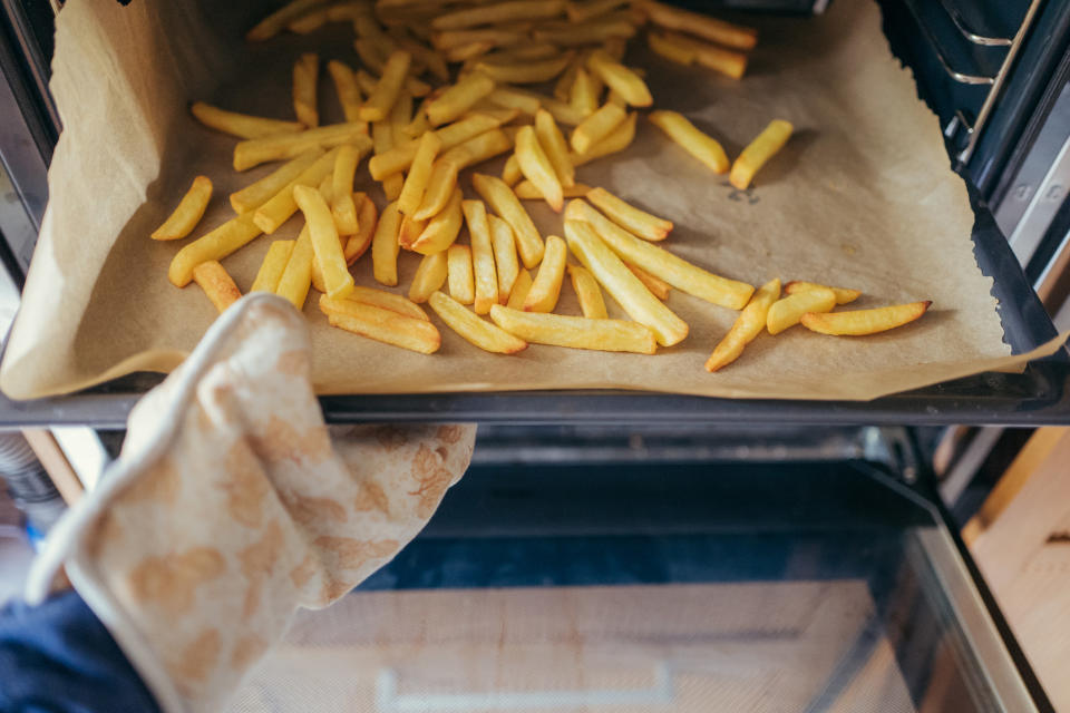 french fries coming out of an oven