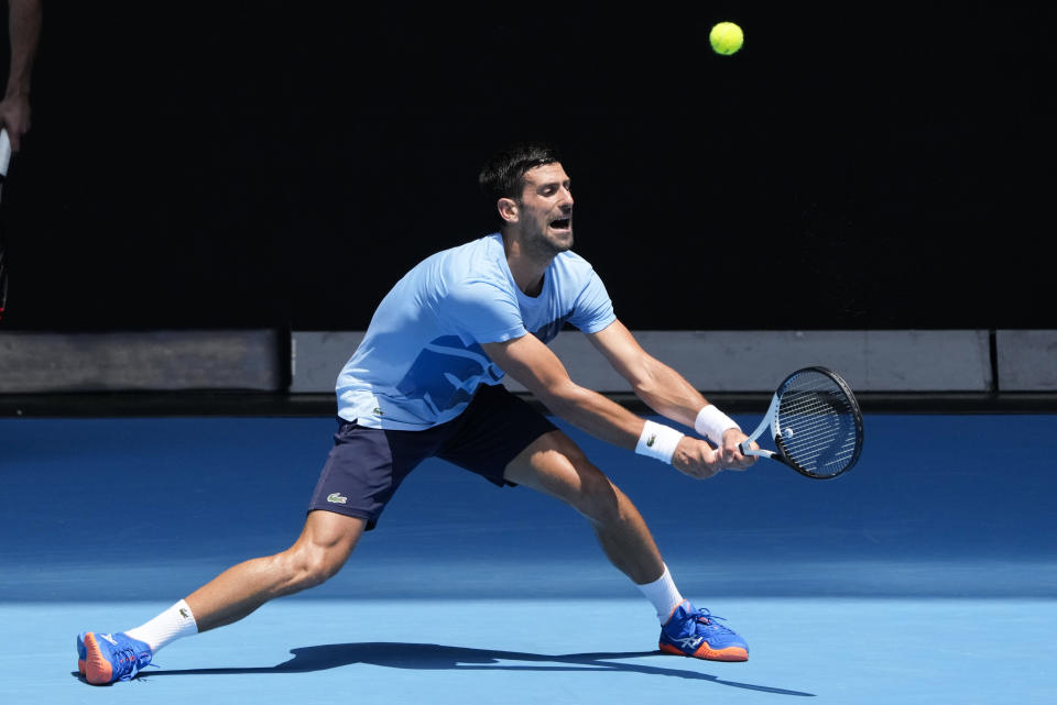 Serbia's Novak Djokovic plays a backhand return to during a practice session ahead of the Australian Open tennis championship in Melbourne, Australia, Friday, Jan. 13, 2023. (AP Photo/Mark Baker)