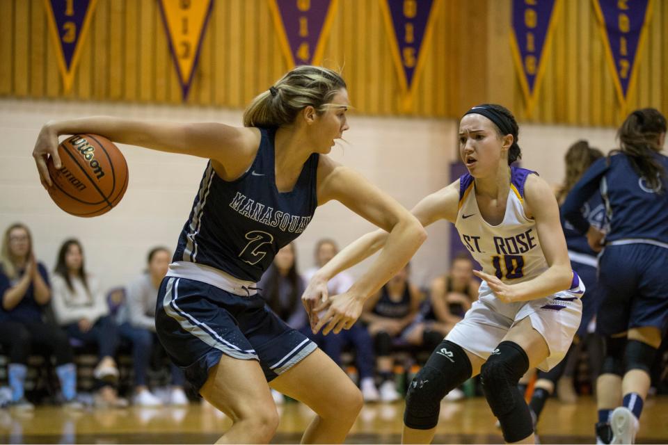 Manasquan vs St. Rose basketball. Manasquan's Lola Mullaney grabs a rebound in front of St. Rose's Abby Antognoli.      Belmar, NJFriday, February 1, 2019