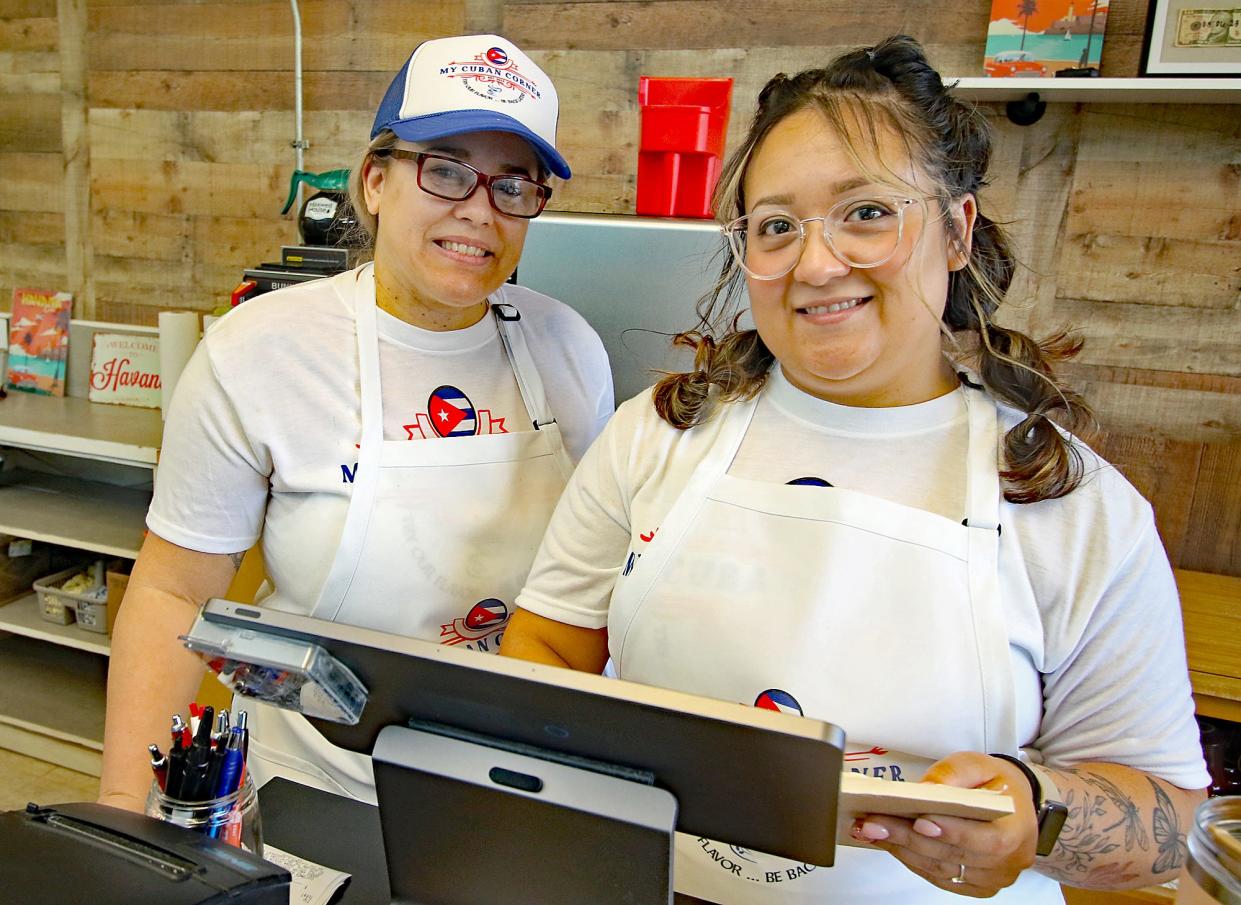 Owner Nicole Montero, left, poses with Nancy Cobos at the fron counter of the newly opened My Cuban Corner on Catawba Street in Belmont Monday morning, March 6, 2023.