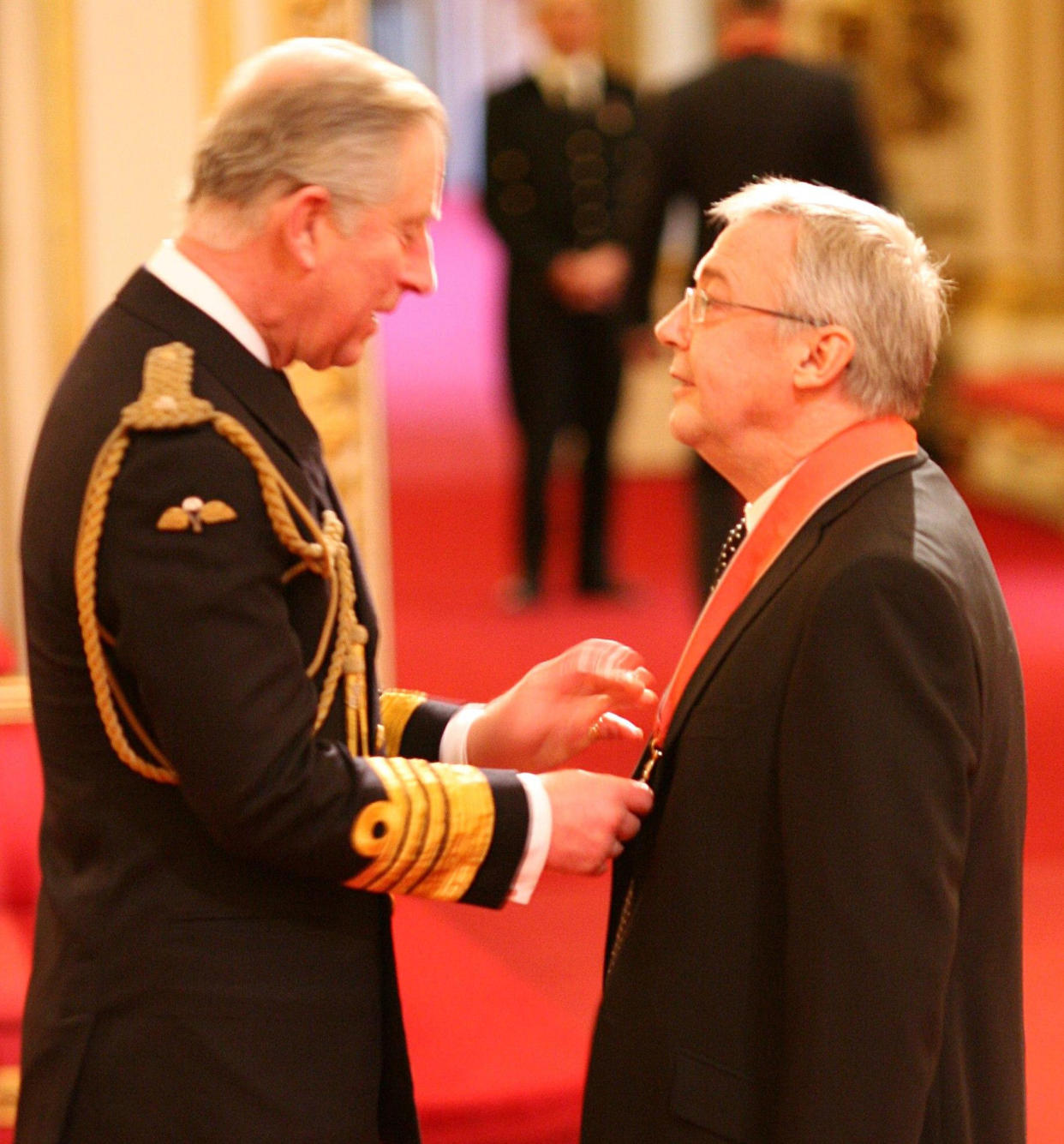 Graham Vick, artistic director of the Birmingham Opera Company, receives his CBE from the Prince of Wales during investitures at Buckingham Palace in London.