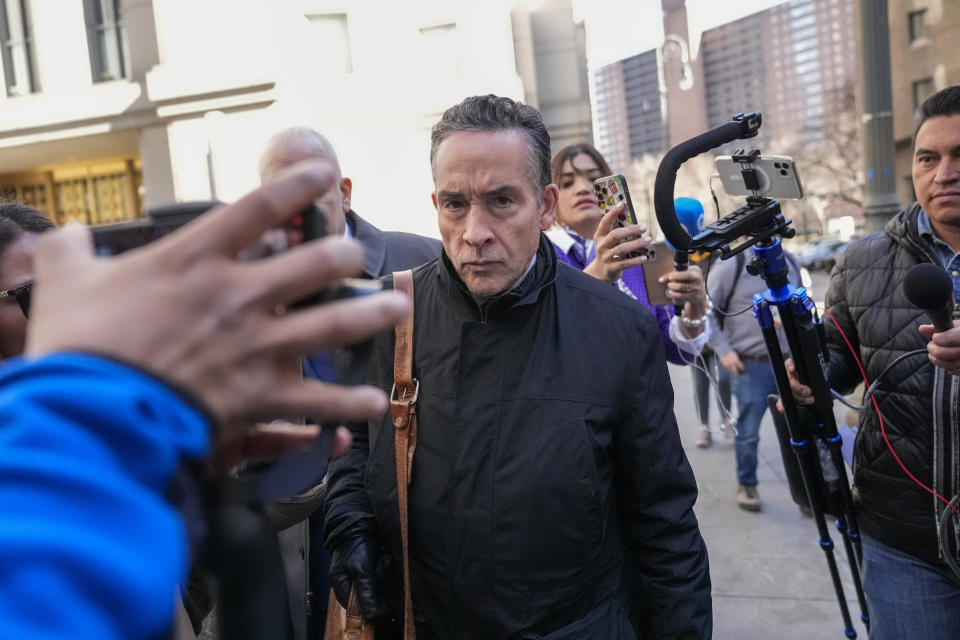 Raymond Colon, lawyer for former Honduran President Juan Orlando Hernandez, is surrounded by reporters as he leaves Federal court, Friday, March 8, 2024, in New York. Former Honduran President Juan Orlando Hernandez has been convicted in New York of conspiring with drug traffickers, his military and police to enable tons of cocaine to reach the United States. (AP Photo/Mary Altaffer)