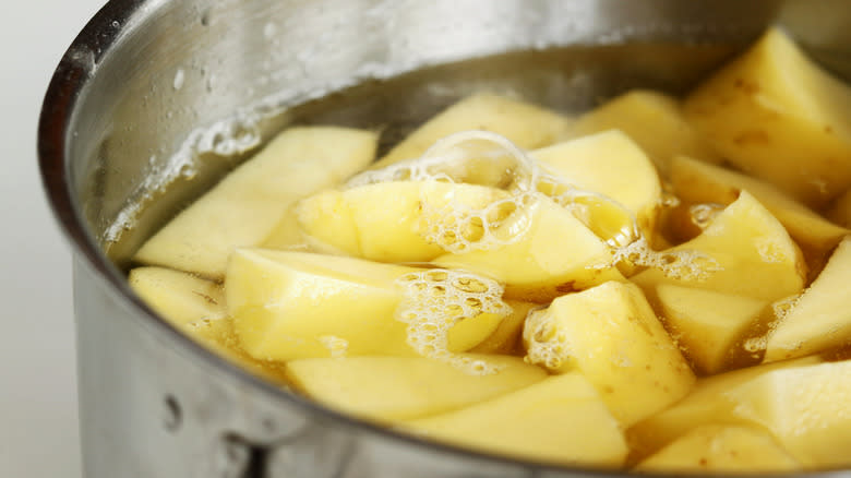 Pot of boiling potato chunks