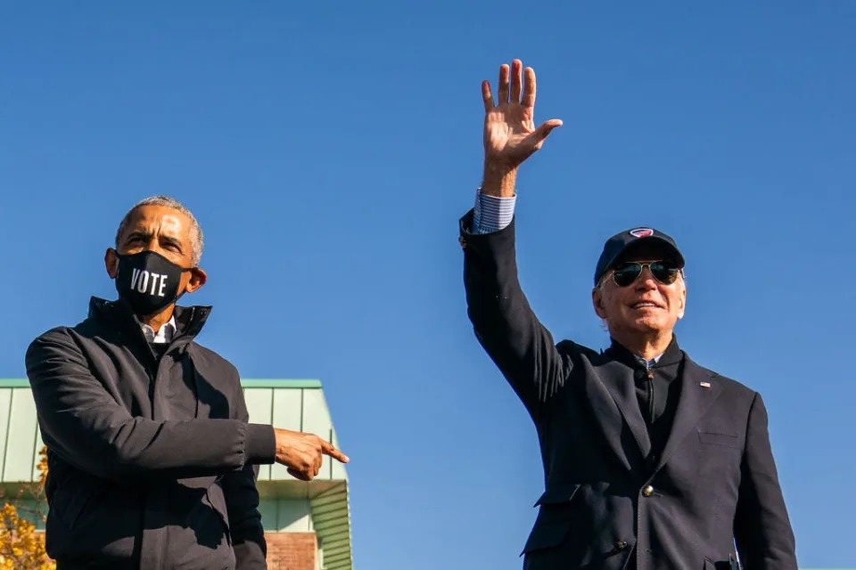 Barack Obama and Joe Biden campaign together.