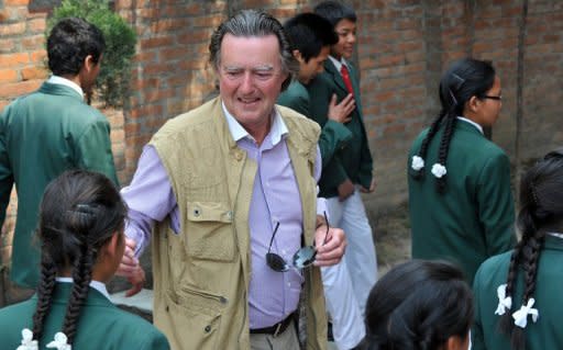 This file photo shows the founder of The Humla Children's Home charity, Eugene Lane-Spollen, interacting with Humla children at his home in Kathmandu