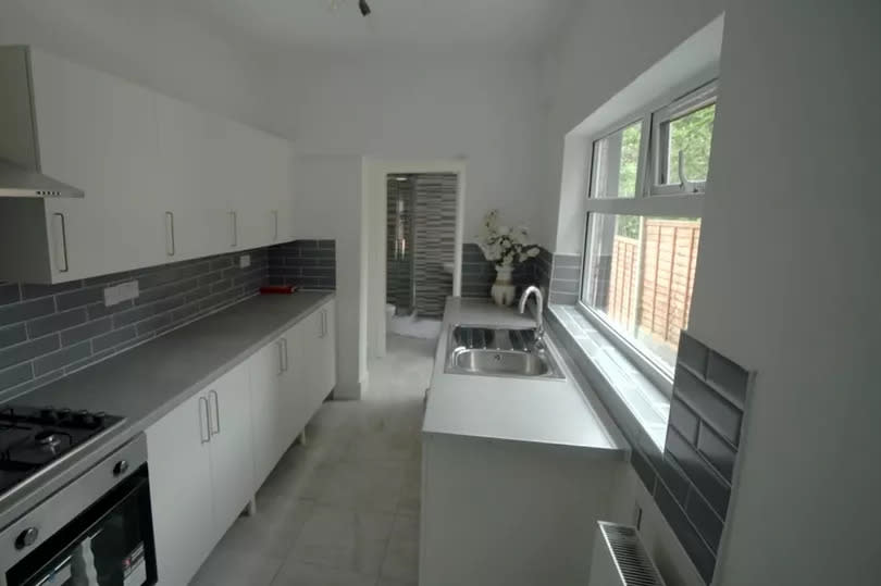 A modern, grey and white kitchen