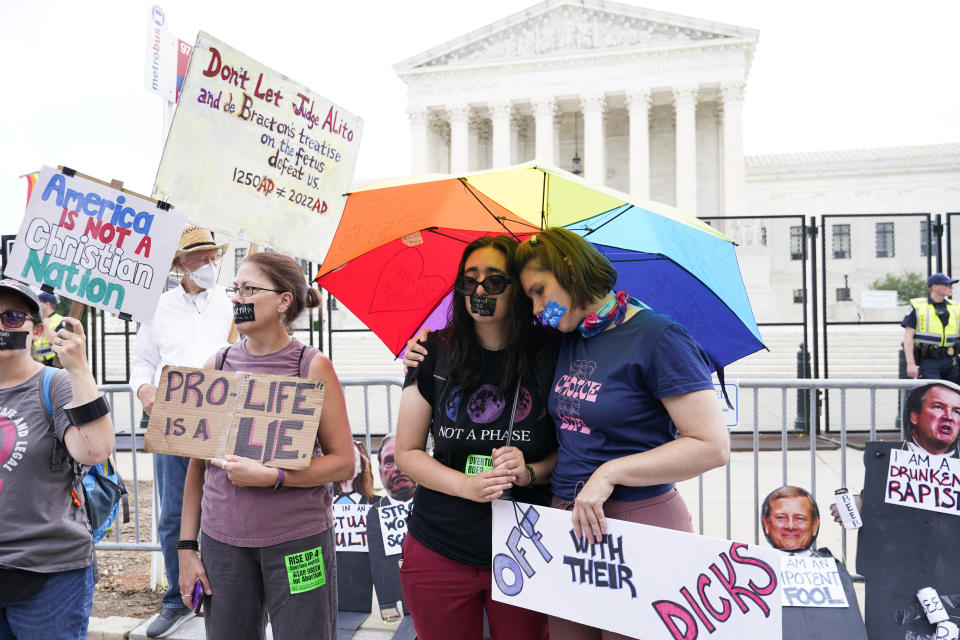 Abortion-rights activists react outside the Supreme Court in Washington, Friday, June 24, 2022. The Supreme Court has ended constitutional protections for abortion that had been in place nearly 50 years in a decision by its conservative majority to overturn Roe v. Wade. (AP Photo/Jacquelyn Martin)