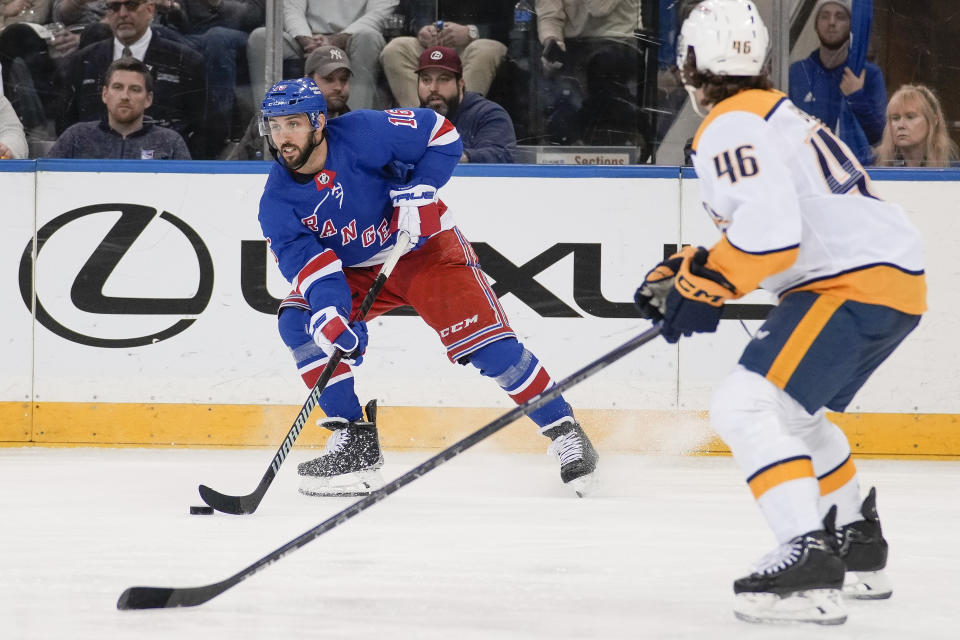 New York Rangers center Vincent Trocheck (16) skates with the puck during the third period of the team's NHL hockey game against the Nashville Predators Sunday, March 19, 2023, in New York. (AP Photo/Bryan Woolston)