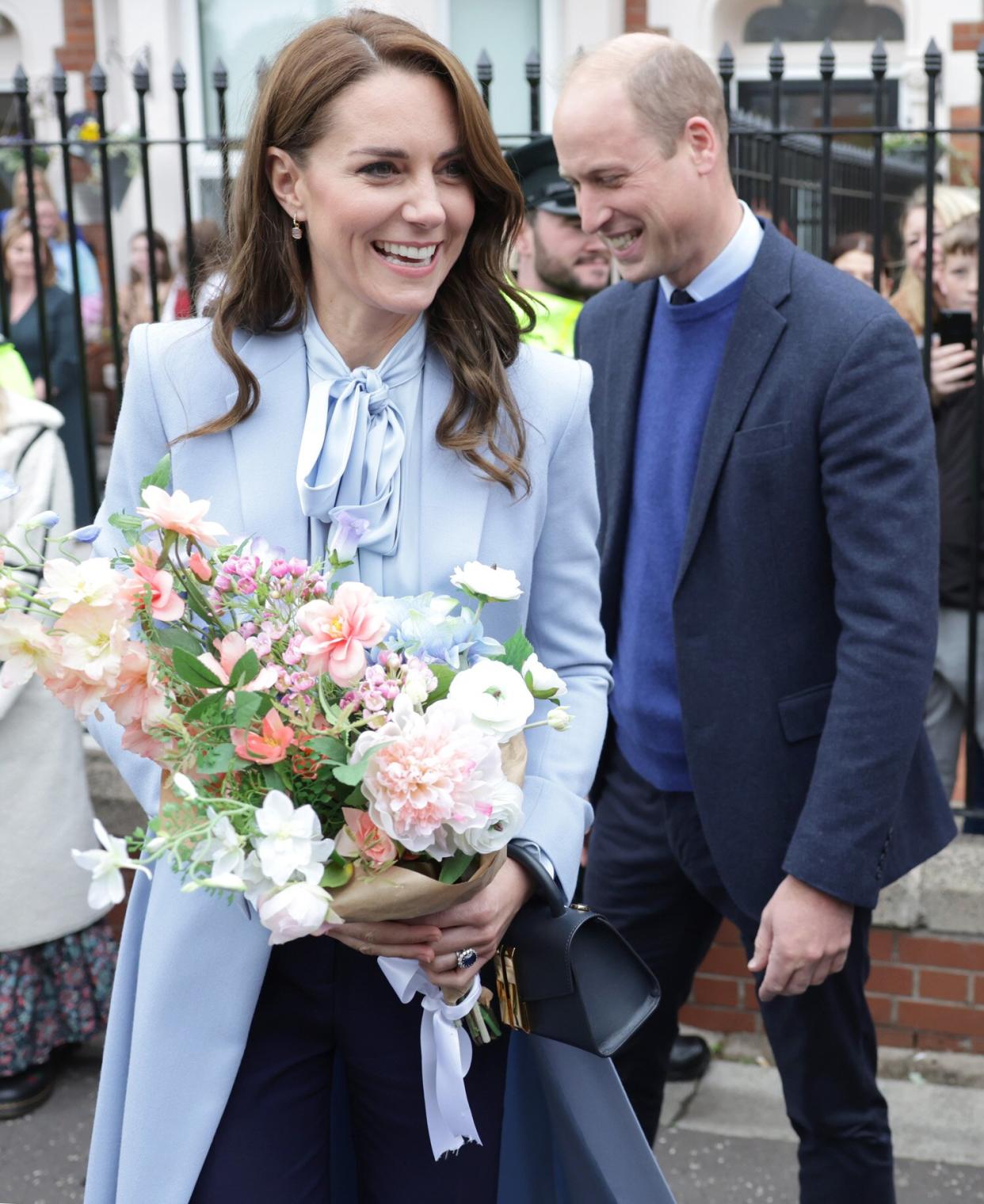 Catherine, Princess of Wales and Prince William, Prince of Wales smile as they speak with well-wishers after their visit to the PIPS (Public Initiative for Prevention of Suicide and Self Harm) charity on October 06, 2022 in Belfast, Northern Ireland