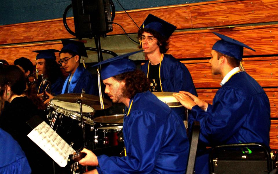 Students perform with the band during Hull High School's graduation on Saturday, June 3, 2023.